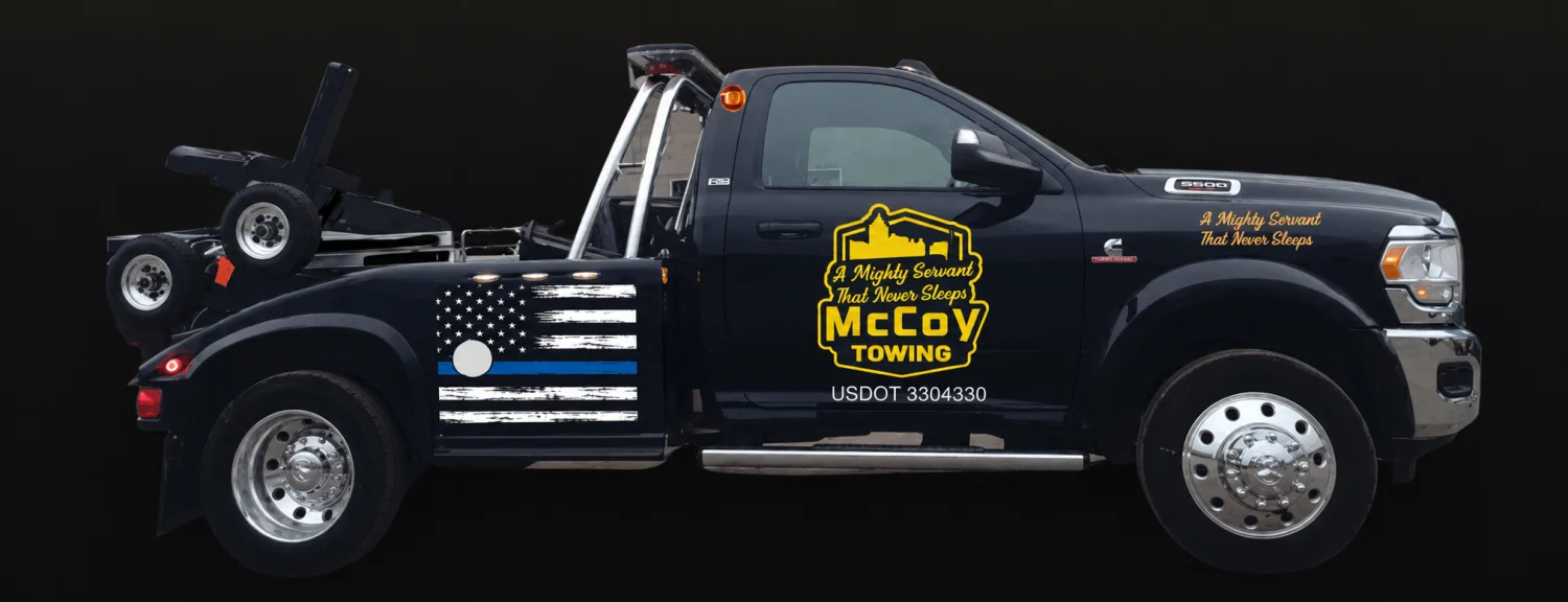 McCoy Towing wrecker with American flag